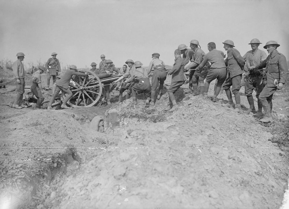 A Royal Field Artillery gun crew haul an 18-pounder into position near Delville Wood, 15 September 1916.
